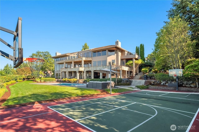 6411 View St NE, Tacoma, WA 98422 - view of basketball court with community basketball court, a lawn, and an outdoor pool