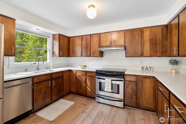 4530 Vacca Ln, Bellingham, WA 98226 - kitchen featuring appliances with stainless steel finishes, under cabinet range hood, and light countertops