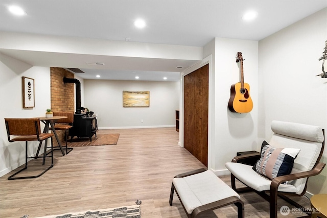 4530 Vacca Ln, Bellingham, WA 98226 - living area with light wood-type flooring, a wood stove, and recessed lighting