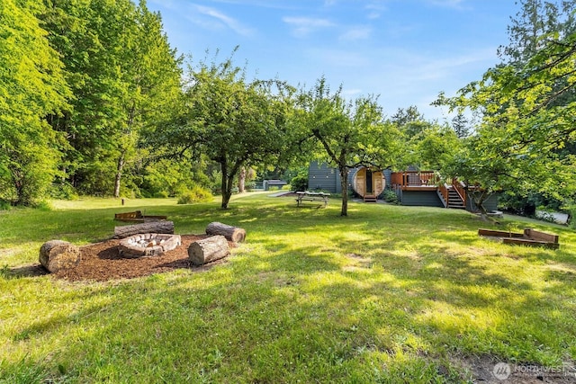 4530 Vacca Ln, Bellingham, WA 98226 - view of green lawn featuring a deck and stairs