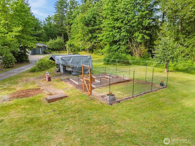 4530 Vacca Ln, Bellingham, WA 98226 - view of grassy yard with a vegetable garden and an outdoor structure