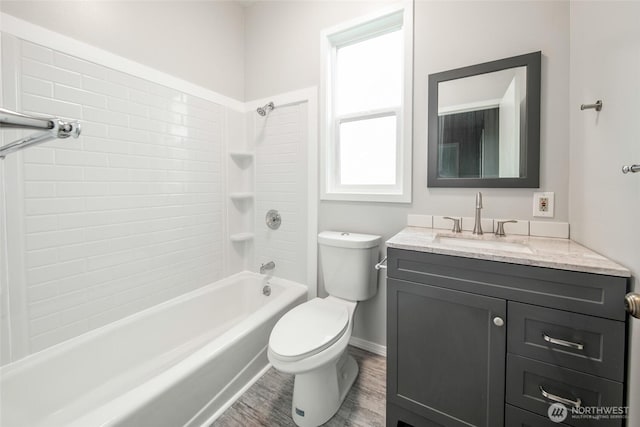 6753 14th Ave NW, Seattle, WA 98117 - bathroom with vanity, washtub / shower combination, and wood finished floors