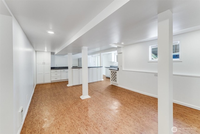 6753 14th Ave NW, Seattle, WA 98117 - below grade area with light wood-style flooring and recessed lighting