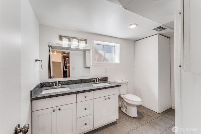 6753 14th Ave NW, Seattle, WA 98117 - bathroom with double vanity and tile patterned flooring