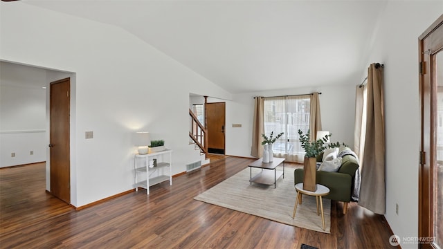 5109 S Myrtle St, Seattle, WA 98118 - living area with vaulted ceiling, stairway, and wood finished floors