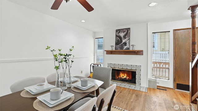 5109 S Myrtle St, Seattle, WA 98118 - dining room featuring a ceiling fan, a tiled fireplace, wood finished floors, and recessed lighting