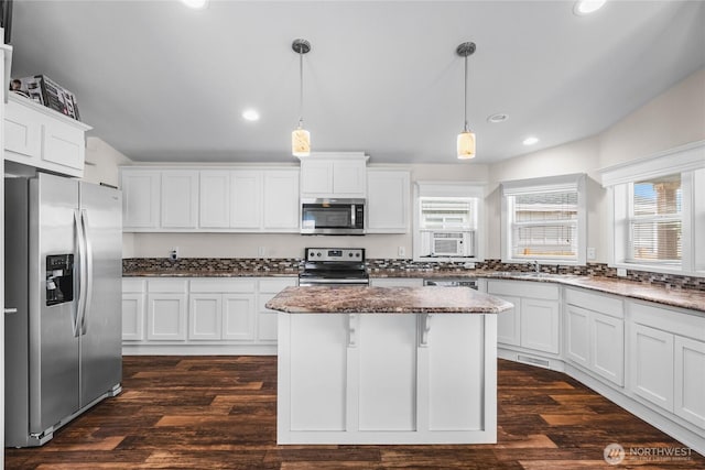 120 L St SE, Auburn, WA 98002 - kitchen with appliances with stainless steel finishes, recessed lighting, and white cabinetry