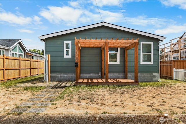 120 L St SE, Auburn, WA 98002 - rear view of house featuring a pergola and a fenced backyard