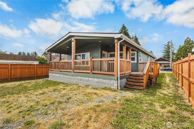 120 L St SE, Auburn, WA 98002 - back of property with a fenced backyard and a deck