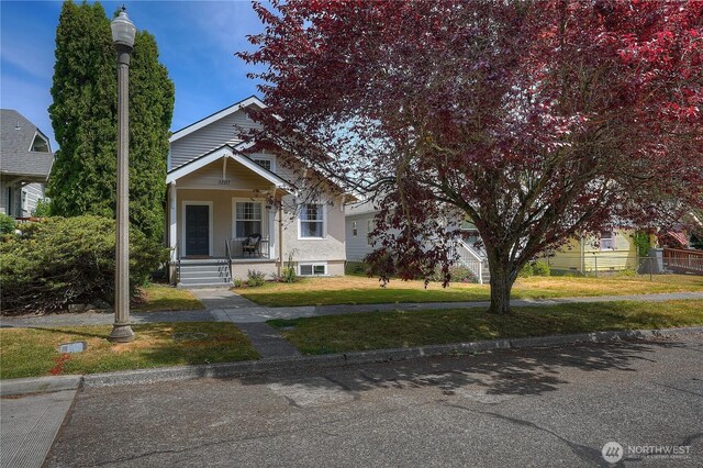 3207 N 9th St, Tacoma, WA 98406 - view of front of property with covered porch and a front yard