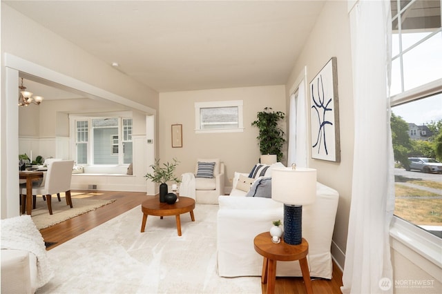 3207 N 9th St, Tacoma, WA 98406 - living area with wood finished floors and a chandelier