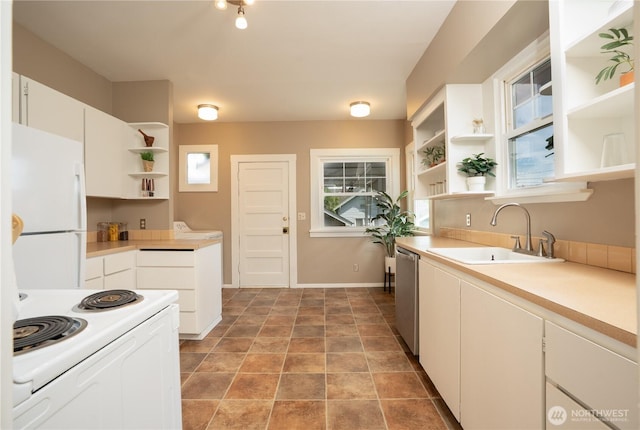3207 N 9th St, Tacoma, WA 98406 - kitchen with open shelves, white appliances, light countertops, and white cabinets