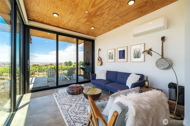 23648 Cliffe Pointe Rd NW Unit 10C, Quincy, WA 98848 - living area with expansive windows, an AC wall unit, wood ceiling, finished concrete floors, and recessed lighting
