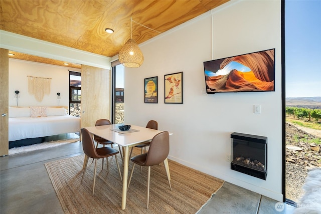 23648 Cliffe Pointe Rd NW Unit 10C, Quincy, WA 98848 - dining space with concrete flooring, healthy amount of natural light, a glass covered fireplace, and recessed lighting