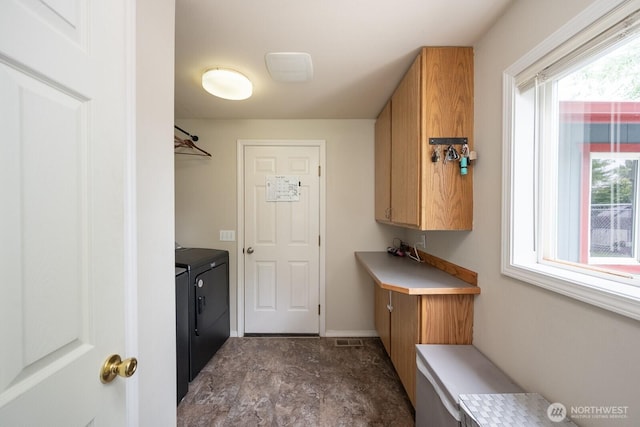 7649 Mcdougal Ave NE, Moses Lake, WA 98837 - laundry area with washing machine and dryer, plenty of natural light, and cabinet space