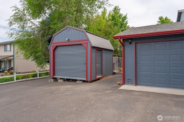 7649 Mcdougal Ave NE, Moses Lake, WA 98837 - garage featuring a storage shed