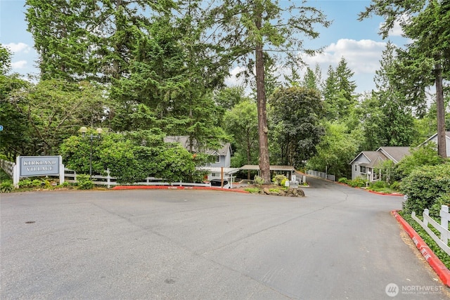13145 102nd Ln NE Unit 6, Kirkland, WA 98034 - view of front of property with view of scattered trees