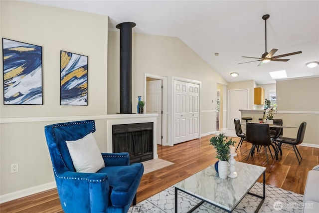 13145 102nd Ln NE Unit 6, Kirkland, WA 98034 - living area with ceiling fan, vaulted ceiling, and wood finished floors