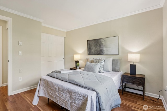 13145 102nd Ln NE Unit 6, Kirkland, WA 98034 - bedroom with wood finished floors, a closet, and crown molding