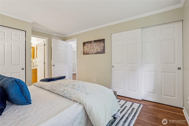 13145 102nd Ln NE Unit 6, Kirkland, WA 98034 - bedroom featuring ornamental molding, wood finished floors, a closet, and ensuite bath