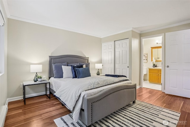 13145 102nd Ln NE Unit 6, Kirkland, WA 98034 - bedroom featuring ornamental molding, light wood-style floors, ensuite bathroom, and a closet