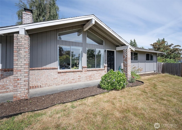 9610 Belmont Dr, Everett, WA 98208 - view of side of property featuring a chimney and brick siding