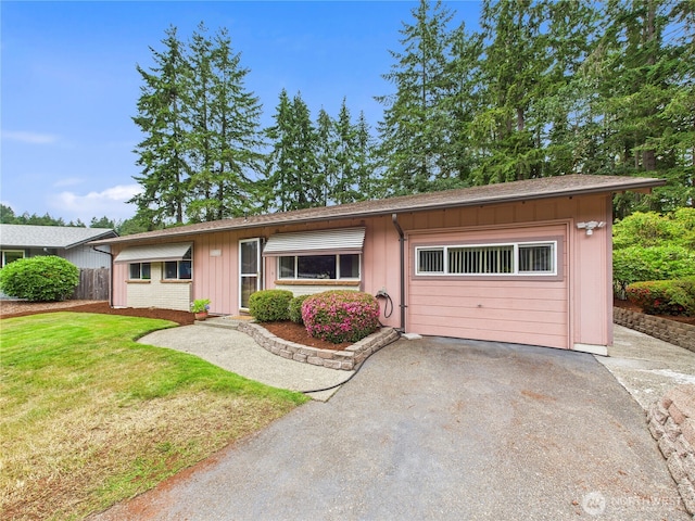 5511 Chokecherry Cir W, University Place, WA 98467 - ranch-style home featuring asphalt driveway, a garage, a front lawn, and board and batten siding