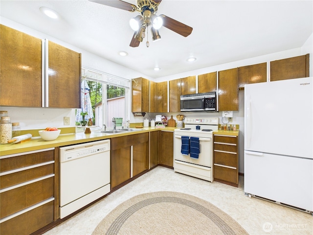 5511 Chokecherry Cir W, University Place, WA 98467 - kitchen with white appliances, light countertops, brown cabinets, recessed lighting, and a ceiling fan