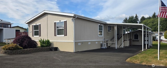 57 Clemons Rd Unit 17, Montesano, WA 98563 - view of front facade featuring a carport