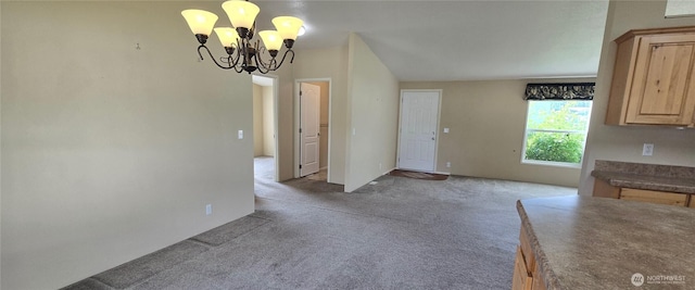 57 Clemons Rd Unit 17, Montesano, WA 98563 - unfurnished dining area featuring a chandelier and carpet flooring