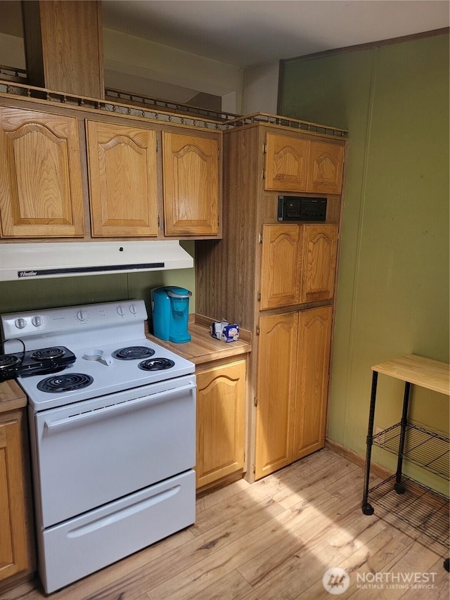 1502 Yelm Ave W Unit 7, Yelm, WA 98597 - kitchen with white electric range, range hood, light wood finished floors, and light countertops