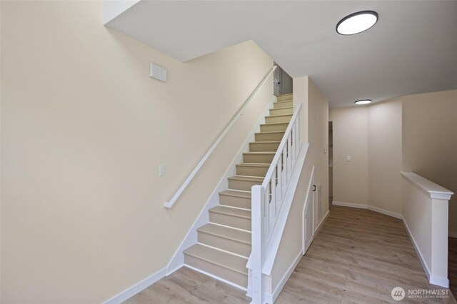 2021 224th Pl NE, Sammamish, WA 98074 - staircase with wood finished floors and baseboards