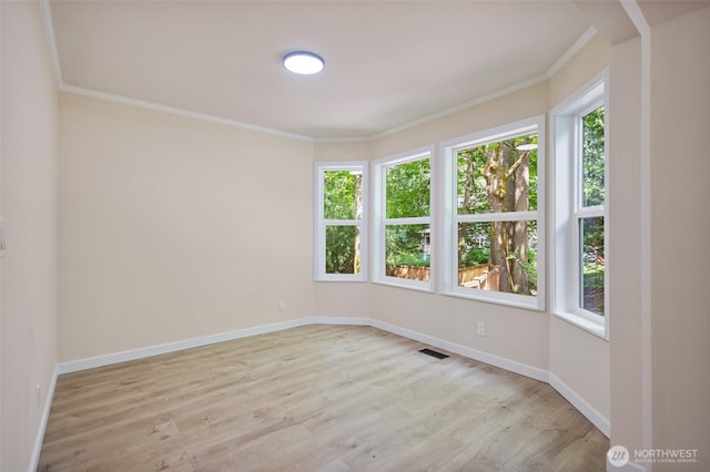 2021 224th Pl NE, Sammamish, WA 98074 - spare room featuring crown molding and light wood-style flooring