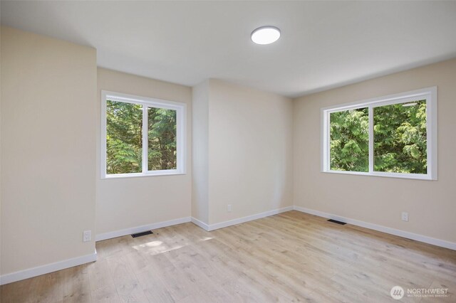 2021 224th Pl NE, Sammamish, WA 98074 - unfurnished room featuring plenty of natural light and light wood-type flooring