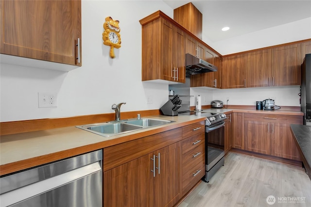 990 43rd Ct NE, Auburn, WA 98002 - kitchen featuring stainless steel appliances, under cabinet range hood, brown cabinets, light wood-style flooring, and recessed lighting