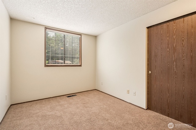 8524 46th Ct NE, Olympia, WA 98516 - carpeted spare room with a textured ceiling