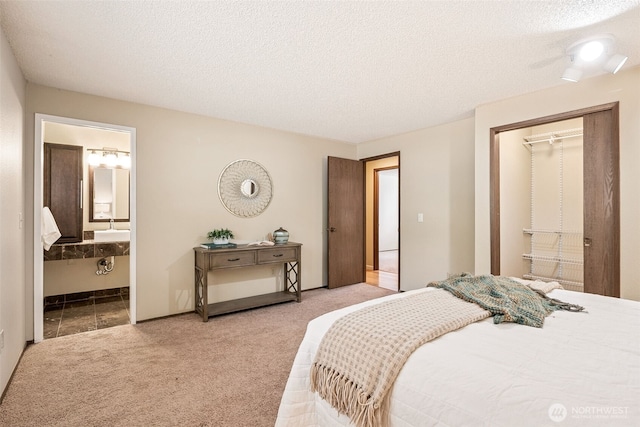 8524 46th Ct NE, Olympia, WA 98516 - carpeted bedroom with a textured ceiling and connected bathroom