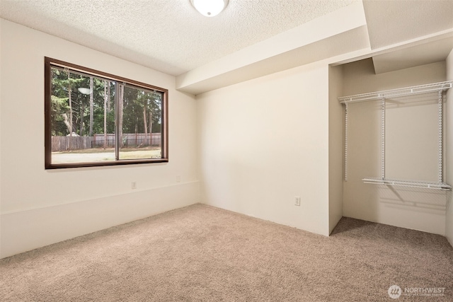 8524 46th Ct NE, Olympia, WA 98516 - unfurnished bedroom with carpet, a closet, and a textured ceiling
