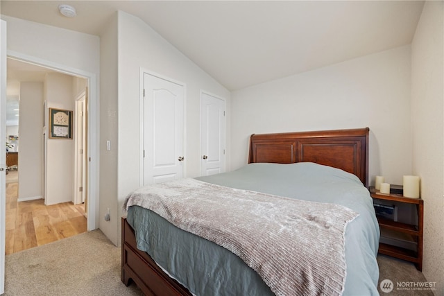 11155 S Lakeshore Rd, Chelan, WA 98816 - bedroom with vaulted ceiling and light colored carpet
