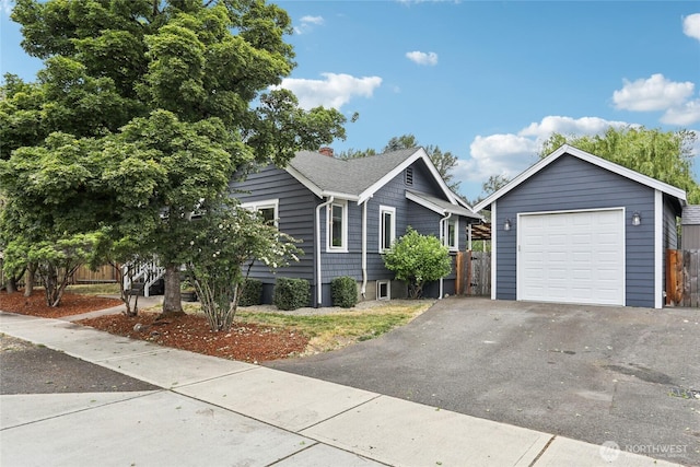 611 Elizabeth St, Sumner, WA 98390 - single story home featuring a garage, driveway, an outbuilding, and a shingled roof