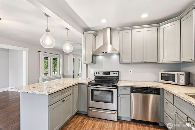 611 Elizabeth St, Sumner, WA 98390 - kitchen with appliances with stainless steel finishes, gray cabinetry, wall chimney exhaust hood, a peninsula, and recessed lighting