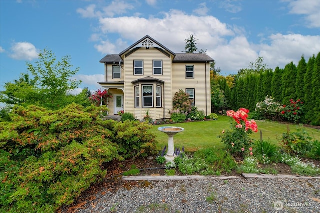 603 W 1st St, Nooksack, WA 98276 - victorian home featuring a front lawn