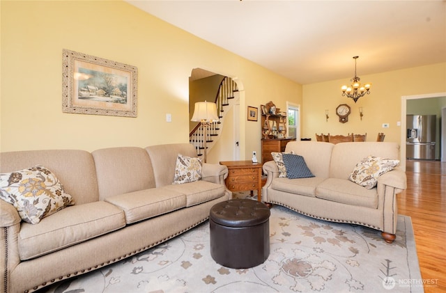 603 W 1st St, Nooksack, WA 98276 - living room with a chandelier, wood finished floors, and stairs
