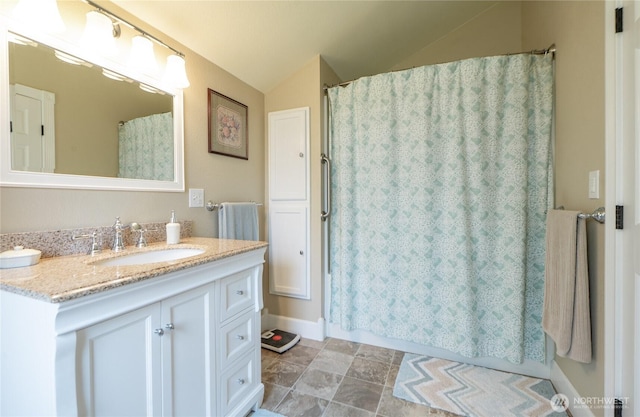603 W 1st St, Nooksack, WA 98276 - full bath with vanity, lofted ceiling, and a shower with curtain