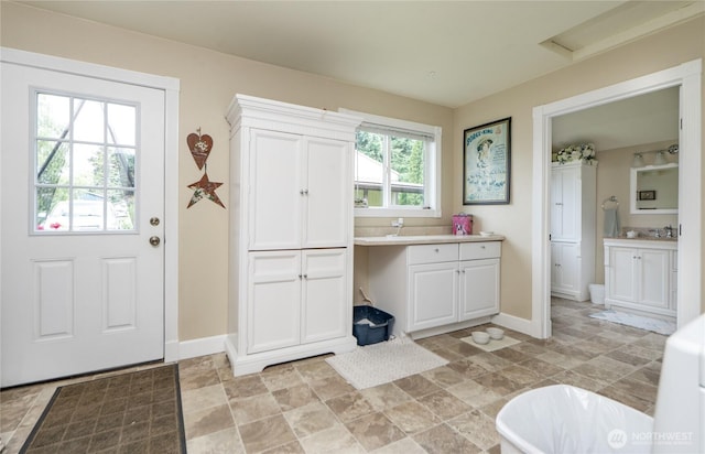 603 W 1st St, Nooksack, WA 98276 - bathroom featuring vanity, a freestanding tub, and stone finish floors