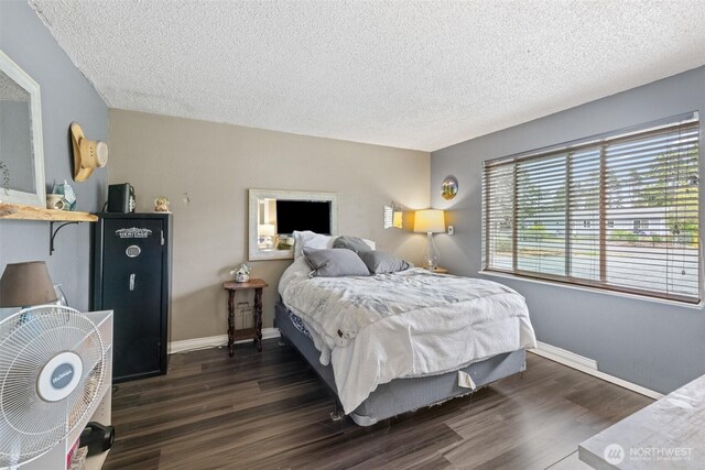 50 W Robert Pl, Sequim, WA 98382 - bedroom featuring a textured ceiling and dark wood finished floors