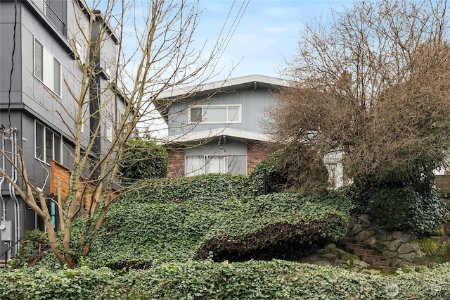 633 W Emerson St, Seattle, WA 98119 - view of home's exterior featuring brick siding