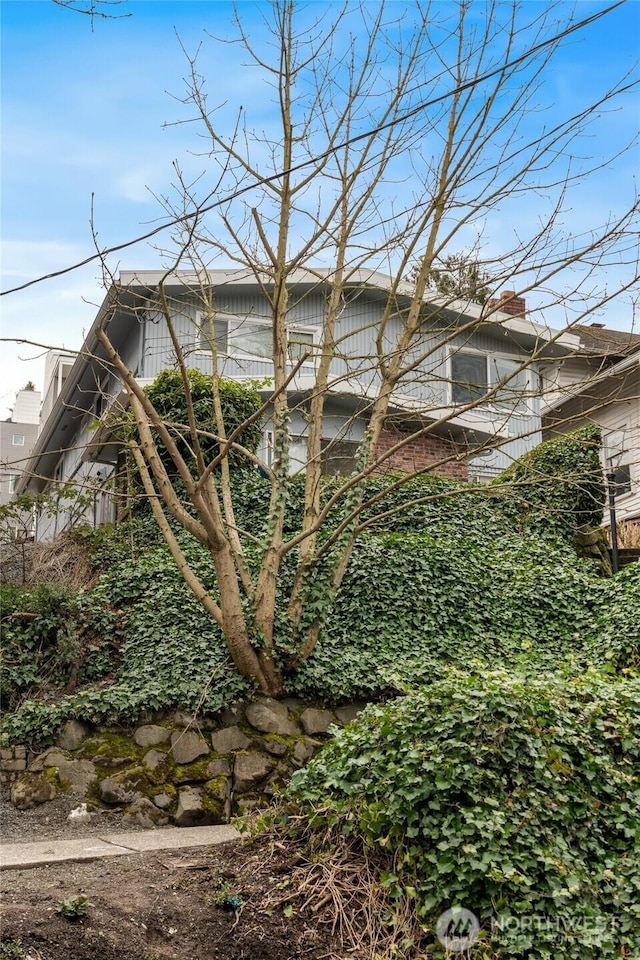 633 W Emerson St, Seattle, WA 98119 - view of side of property featuring a chimney