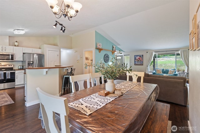 130 Kimberlund Ln, Chehalis, WA 98532 - dining space featuring lofted ceiling, dark wood-style flooring, and a chandelier