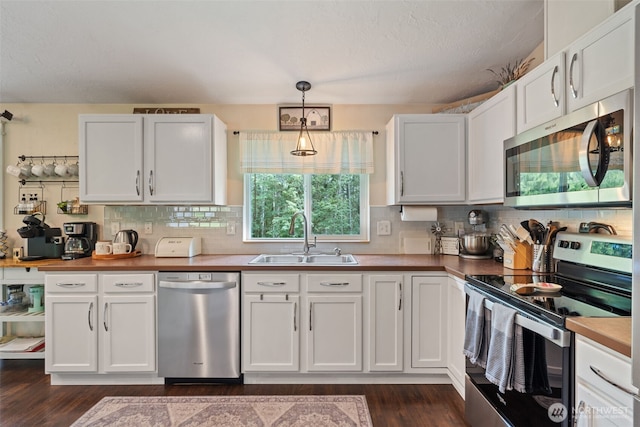 130 Kimberlund Ln, Chehalis, WA 98532 - kitchen with appliances with stainless steel finishes, white cabinetry, and backsplash